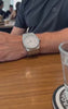 William Corbier RIDGE Alpine customer video: white dial steel watch worn at a cafe table