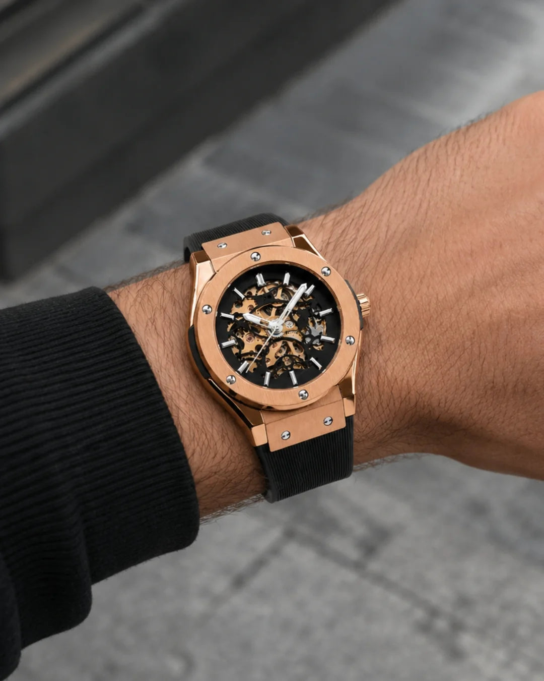 Image of William Corbier MACH Rose Noir men's automatic skeleton watch, worn on a city pavement