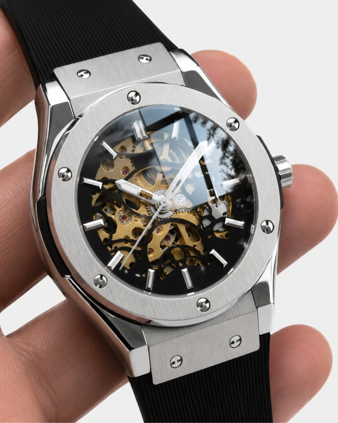 Image of William Corbier MACH Silver Mist men's automatic skeleton watch, held in a hand