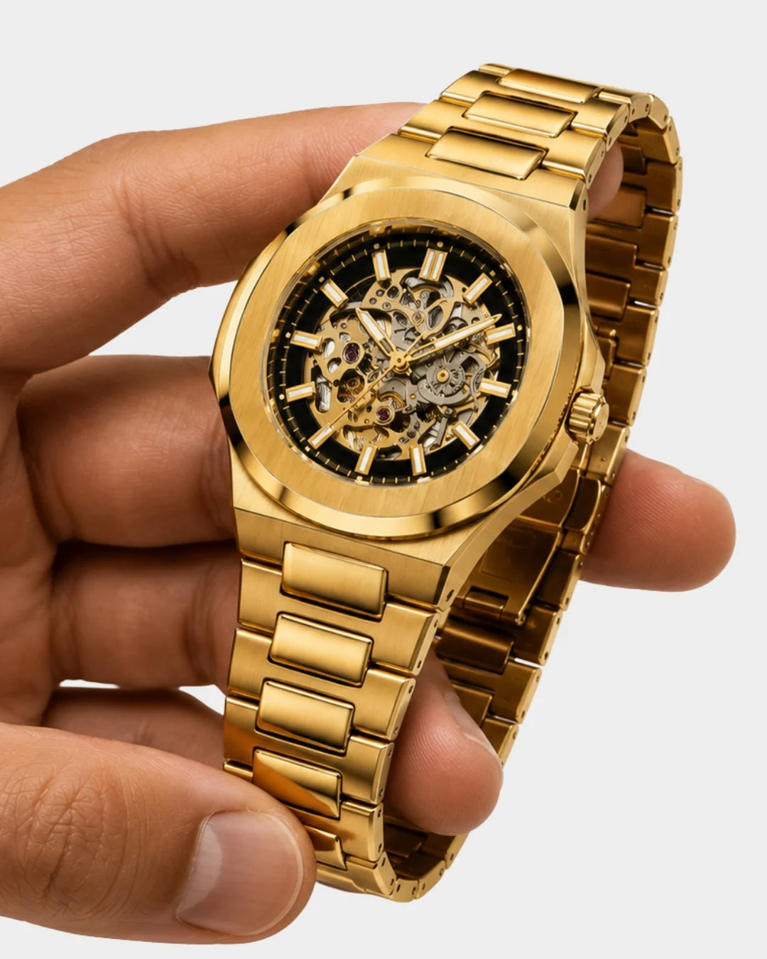 Image of William Corbier PIVOT Imperial Gold men's automatic skeleton watch, held in a hand