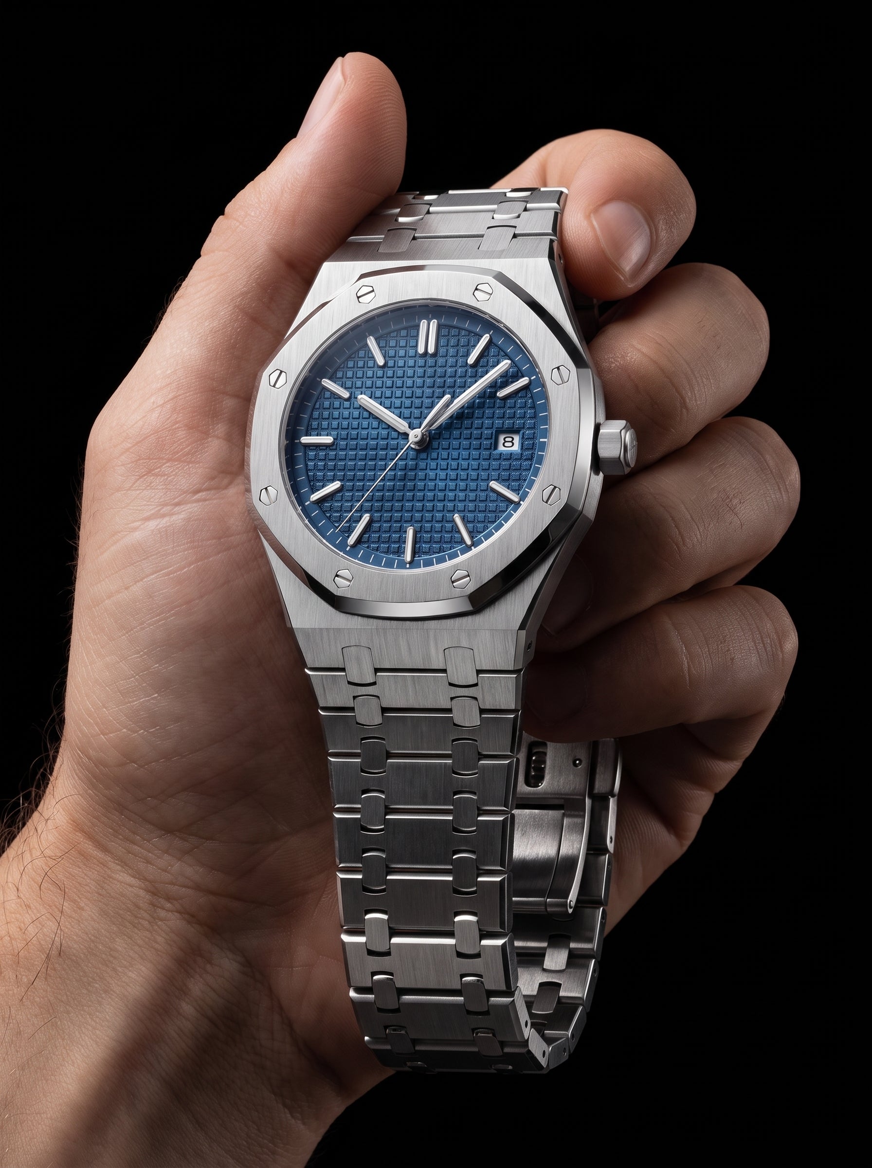 Image of William Corbier RIDGE Dark Azure men's blue dial steel watch, held in a hand against a black background