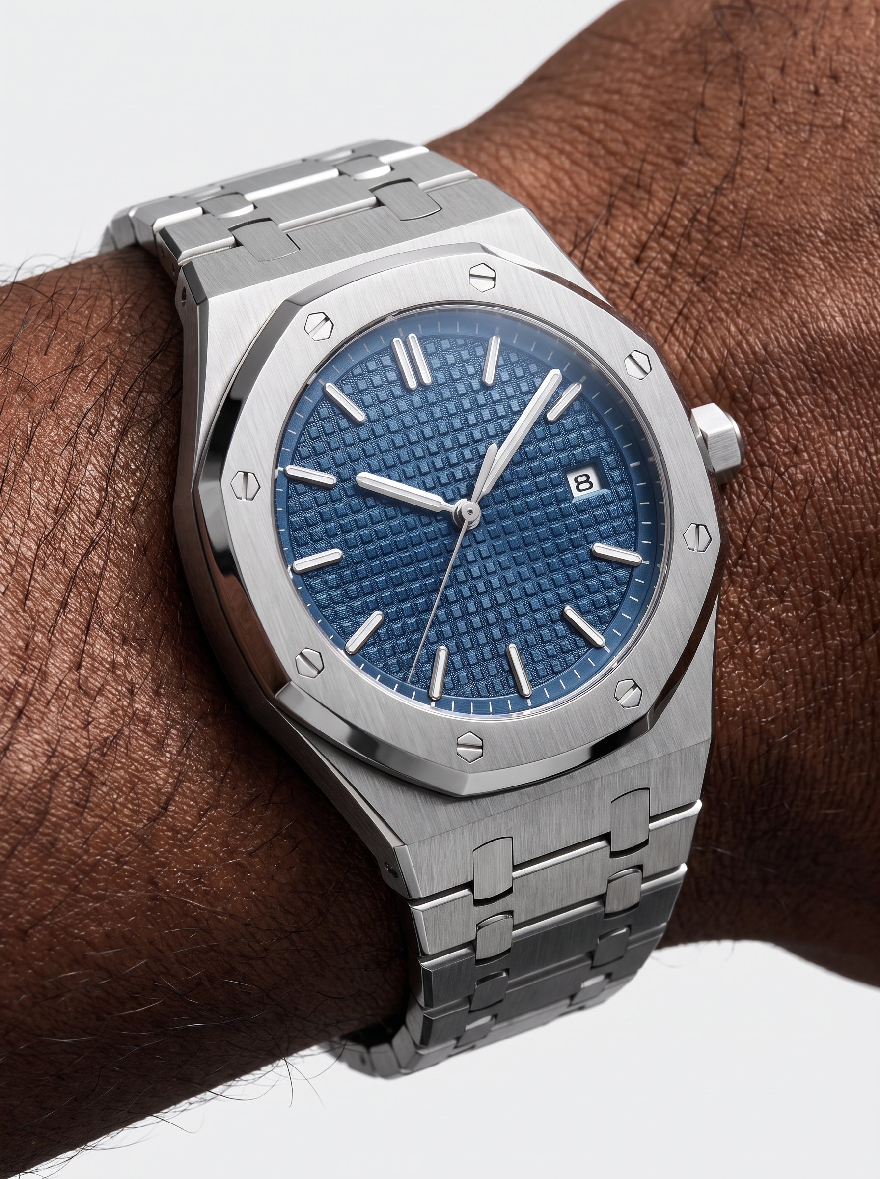 Image of William Corbier RIDGE Dark Azure men's blue dial steel watch, worn on a wrist close-up on a dark-skinned wrist