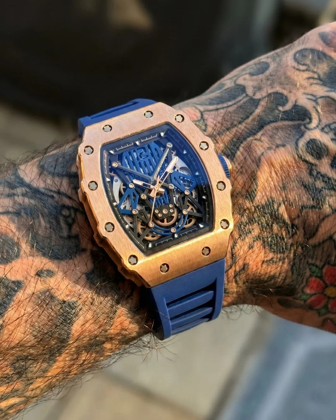 Image of William Corbier SURGE Atlantic men's automatic skeleton watch, worn on a tattooed wrist